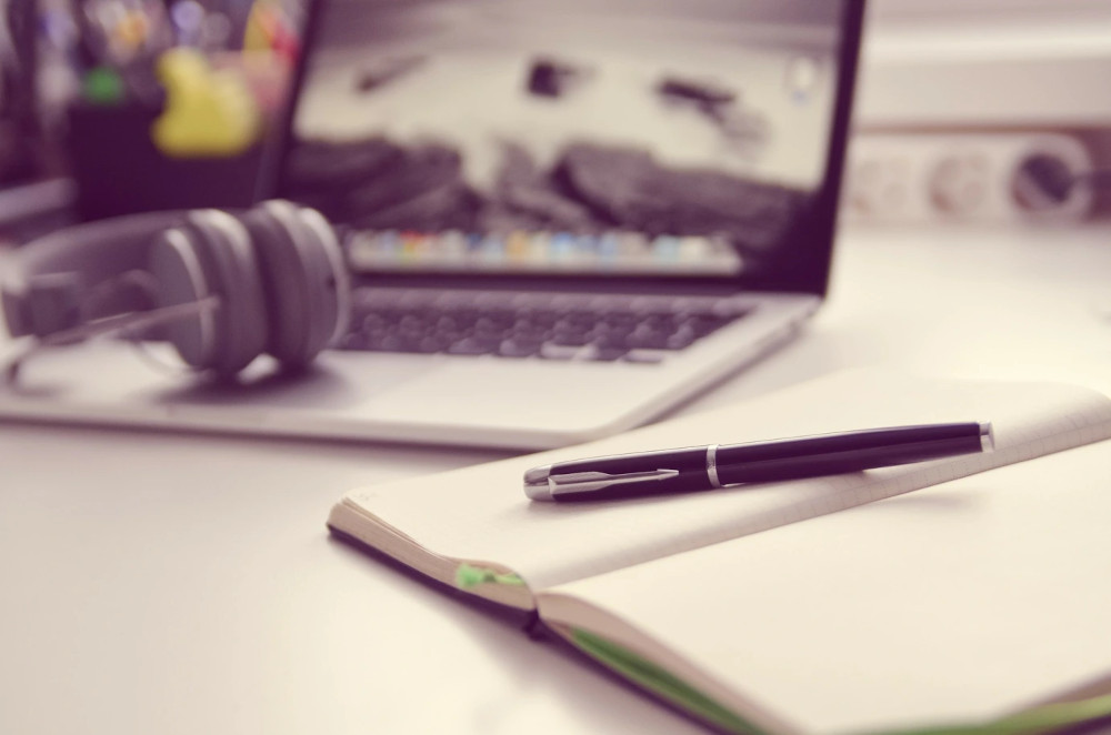 book pen laptop